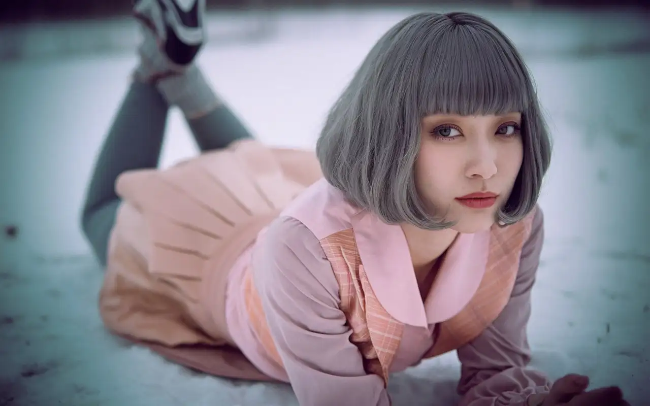 Portrait-of-a-Playful-Shinjuku-Girl-in-Yoga-Pants-Lying-on-Snowy-Ground