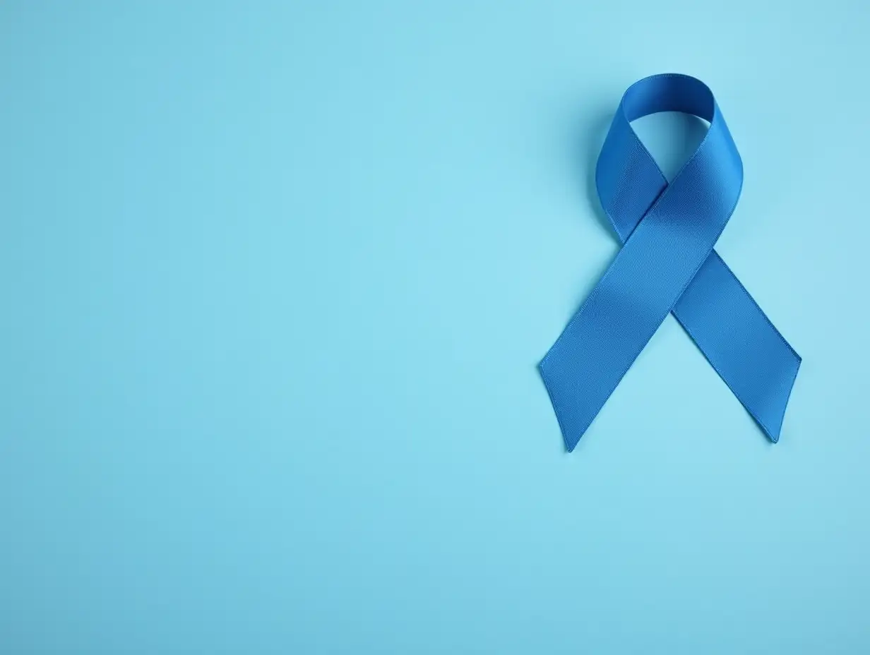 Male urologist with blue ribbon on color background with space for text, closeup. Prostate cancer awareness concept