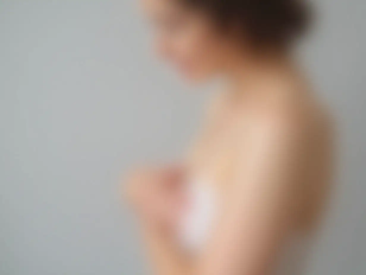 Woman doing breast self-examination on light grey background, closeup. Space for text