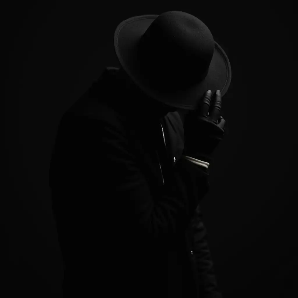 Mysterious-Figure-in-Shadows-with-Black-Hat-and-Jacket