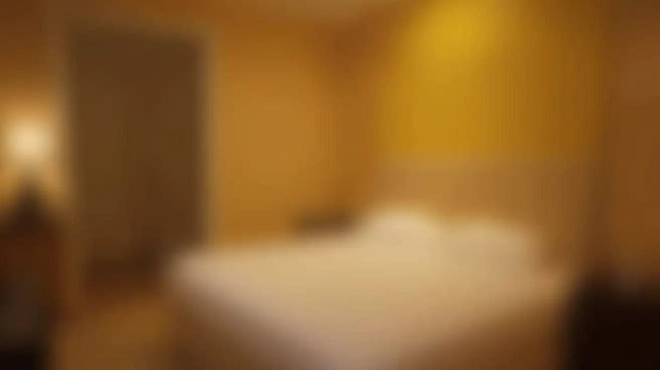 blurred luxurious bedroom with yellow light